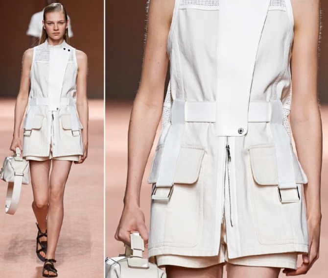 куртка-жакет белого цвета с большими накладными карманами на девушке-модели с подиума в комплекте с шортами, белой сумкой и черными сандалиями - летняя коллекция 2020 от Hermès