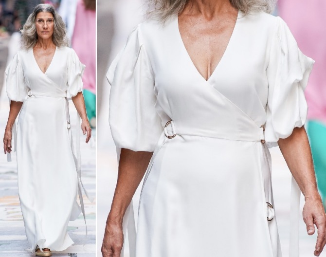 летние фасоны для дам в возрасте: стильное белое платье для пожилых женщин за 60 - с подиума 2020 года - с запахом и рукавами до локтя