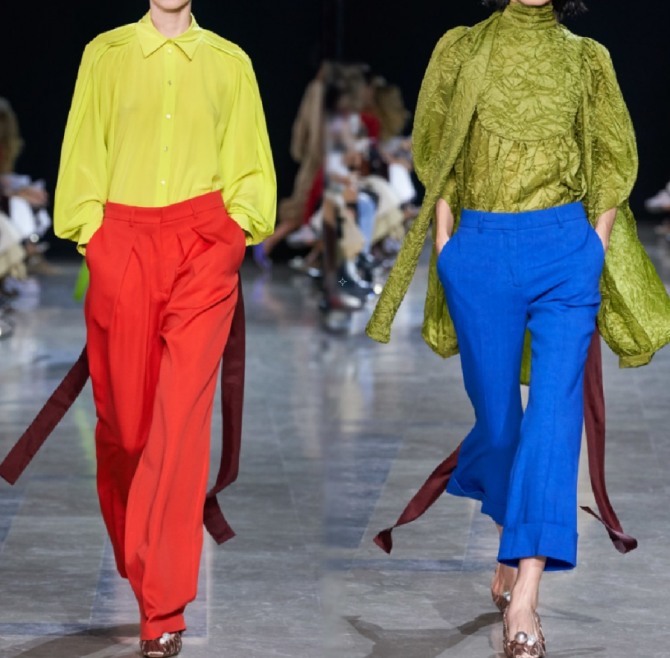 интересные цветовые сочетания блузок в желтой цветовой палитре и брюк красного и синего цвета