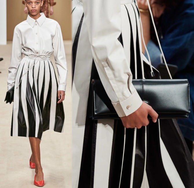 деловой образ весна-лето 2020 от бренда Tod’s: черная сумка-багет в виде конверта с клапаном, белая блузка-рубашка, черно-белая юбка в складку и лодочки карамельного цвета