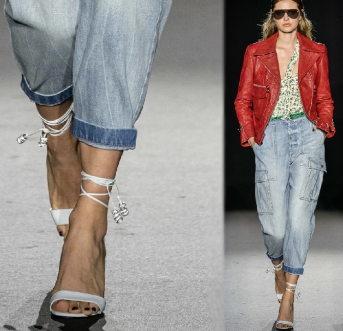 летний образ 2020 года с белыми босоножками, декорированными тонкими ремешками вокруг лодыжки, с джинсовыми женскими штанами с заворотами и красной курткой-косухой - модный лук от бренда Zadig & Voltaire