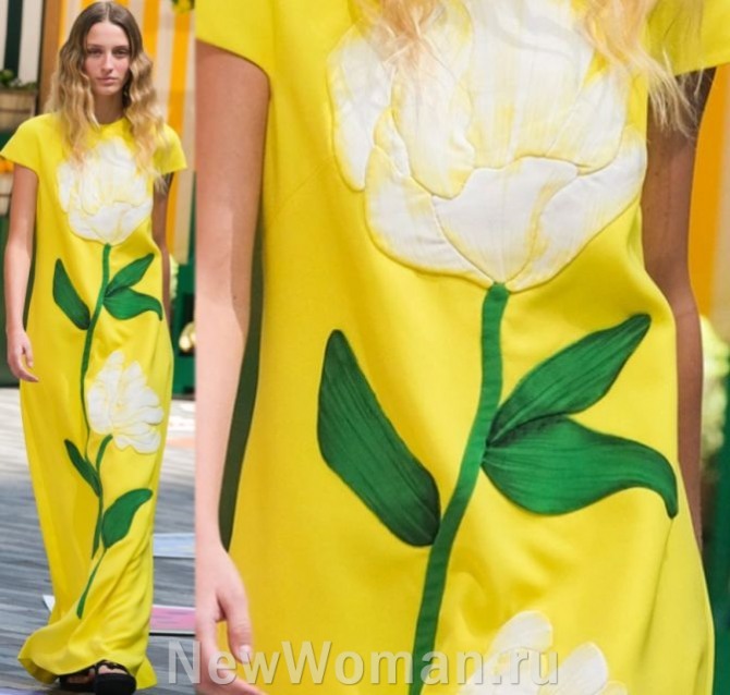 модный декор женской одежды сезона лето 2023 - длинное желтое летнее платье с аппликацией сверху до низу в виде белого тюльпана с зелеными листьями