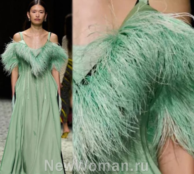 вечернее светло-зеленое длинное платье с меховой отделкой на лифе и рукавах - мода 2024 года