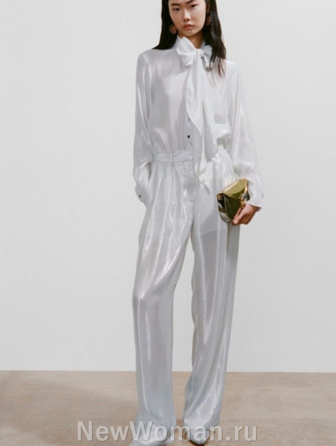 вечерний женский образ 2024 в жемчужно-белой цветовой гамме, полупрозрачные брюки с блеском, блузка с бантом