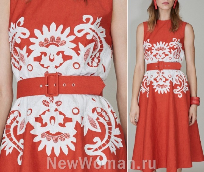 плоские белые аппликации на фоне летнего платья морковного платья