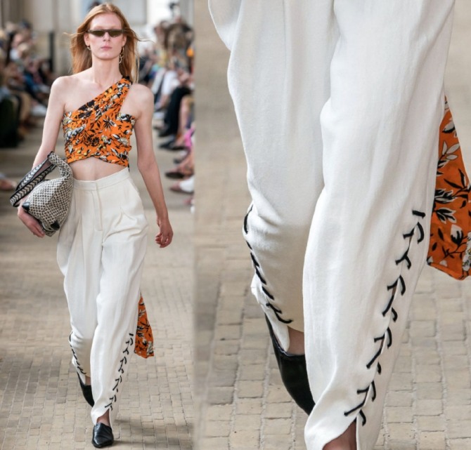 белые женские летние брюки-бананы с цветастым топом и черной шнуровкой - новинки с модных показов весна-лето 2020 от бренда Lala Berlin (Копенгаген)