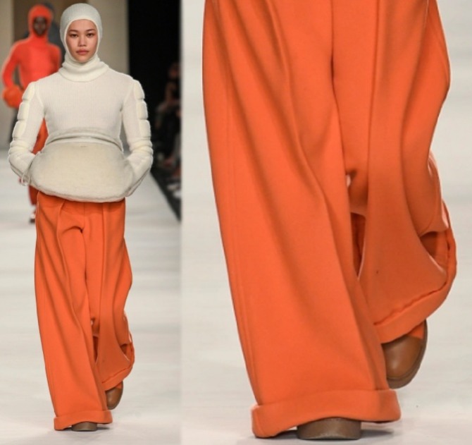 очень широкие зимние брюки палаццо морковного цвета с заворотами внизу штанин