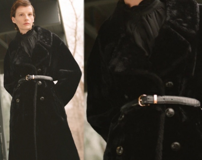 черное меховое пальто из искусственного мутона с кожаным ремнем на талии и с металлическими пуговицами