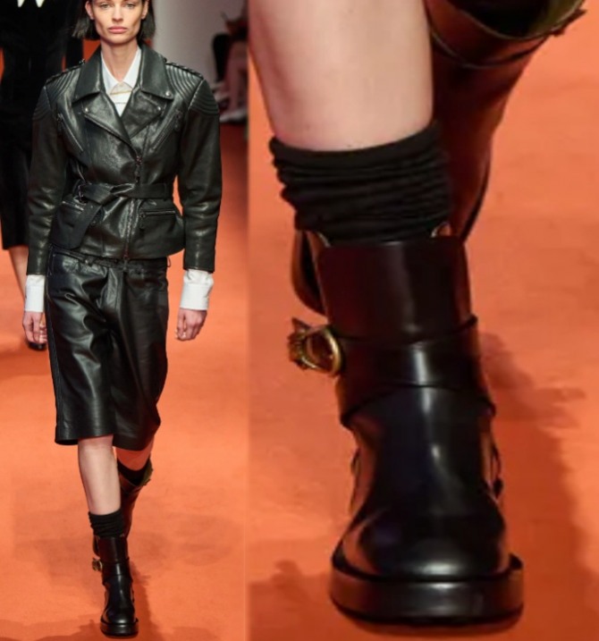 уличная осенняя мода 2023 года - черный кожаный комплект с юбкой, жакетом, черными полусапожками на плоской подошве