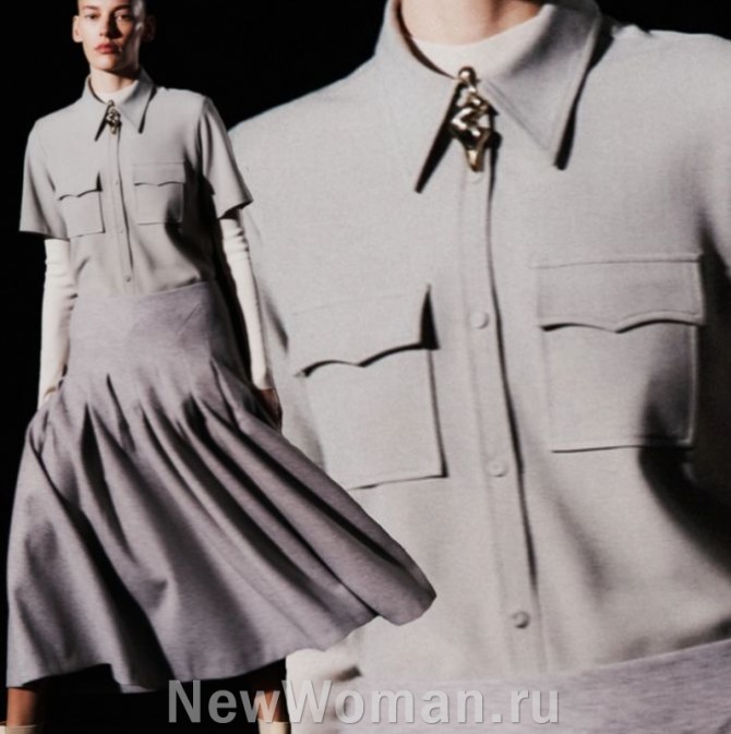 серая деловая блузка с коротким рукавом поверх серой футболки с длинным рукавом -  с кармашками на груди в военном стиле