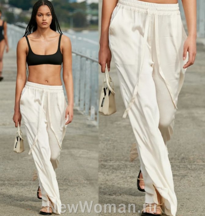 модные летние женские брюки 2024 белого цвета на резинке и кулиске в сочетании с черным топом бралетт